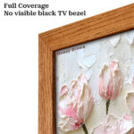 Close-up of the Honey Brown wood TV bezel highlighting the full coverage design that completely hides the black factory edge for a true gallery painting look.