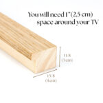 Natural oak TV frame dimension guide, illustrating the simple 1-inch clearance needed around your screen to ensure a flawless, frustration-free installation.