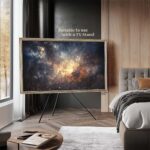 Versatile 65-inch ornate silver TV frame fully compatible with freestanding tripod TV stands for flexible and stylish room placement.