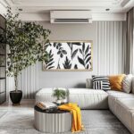 Sleek 55-inch brass TV frame enhancing a modern minimalist living room by disguising the television as upscale wall decor.