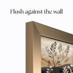 Side profile of the custom brass TV frame demonstrating a flush-to-wall fit for a clean, professional, gallery-quality installation.