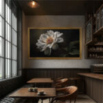 A beautifully framed TV displaying floral art in a moody cafe setting, demonstrating how the frame effortlessly disguises screens in elegant or commercial spaces.