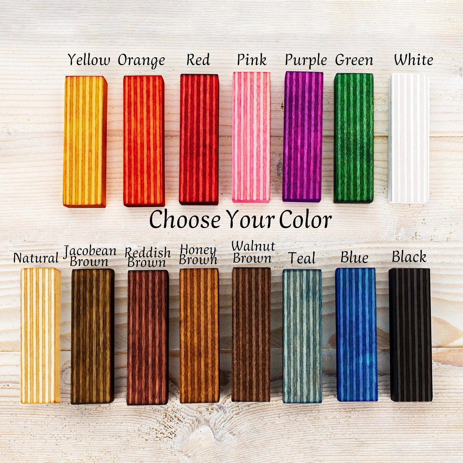 Wooden frame samples in teal green natural brown black blue red orange yellow and white for handmade picture frames.