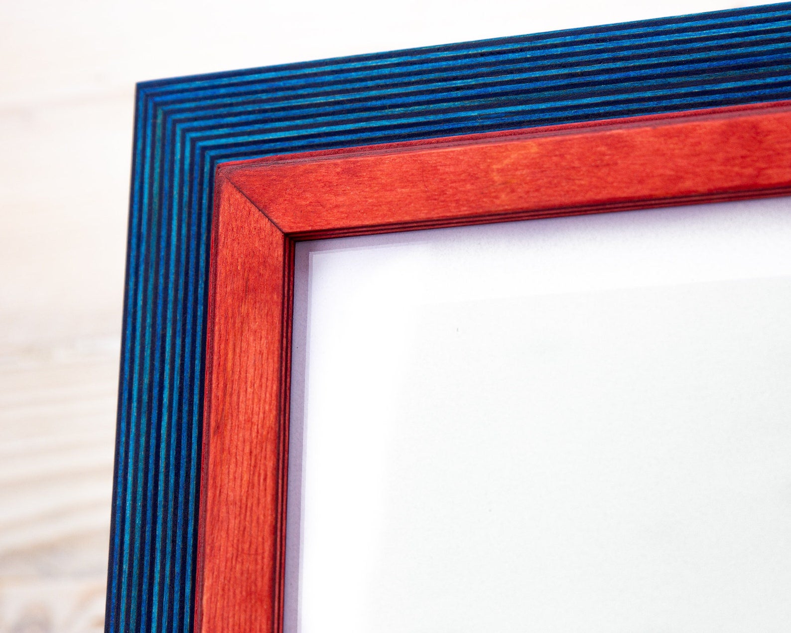 Close-up of a red and blue picture frame on a white background. Blue and Red Picture Frame, Wooden Photo Frame, Double Picture Frame SIZES- 4x4 4x6 5x5 5x7 5.5x8.5 6x6 6x8 8x8 8x10 10x10 8x12 8.5x11 11x14