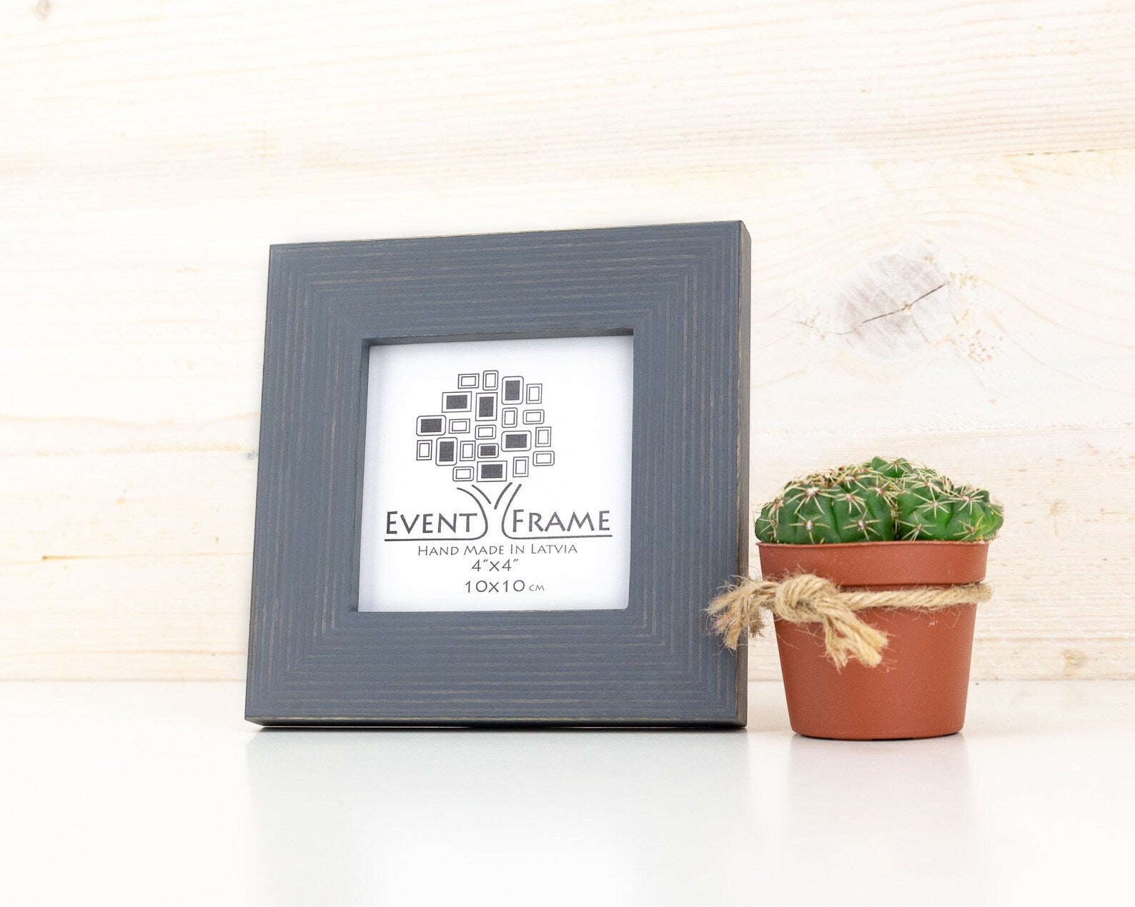 Gray picture frame with 'Event Frame' label next to a potted cactus on a light wooden surface. Grey Wooden Picture Frame, Handmade Custom Size Photo Frame, Stripy Design Poster Frame A1 A2 5x7 10x10 8x10 12x18 16x20 18x24 20x30 24x36
