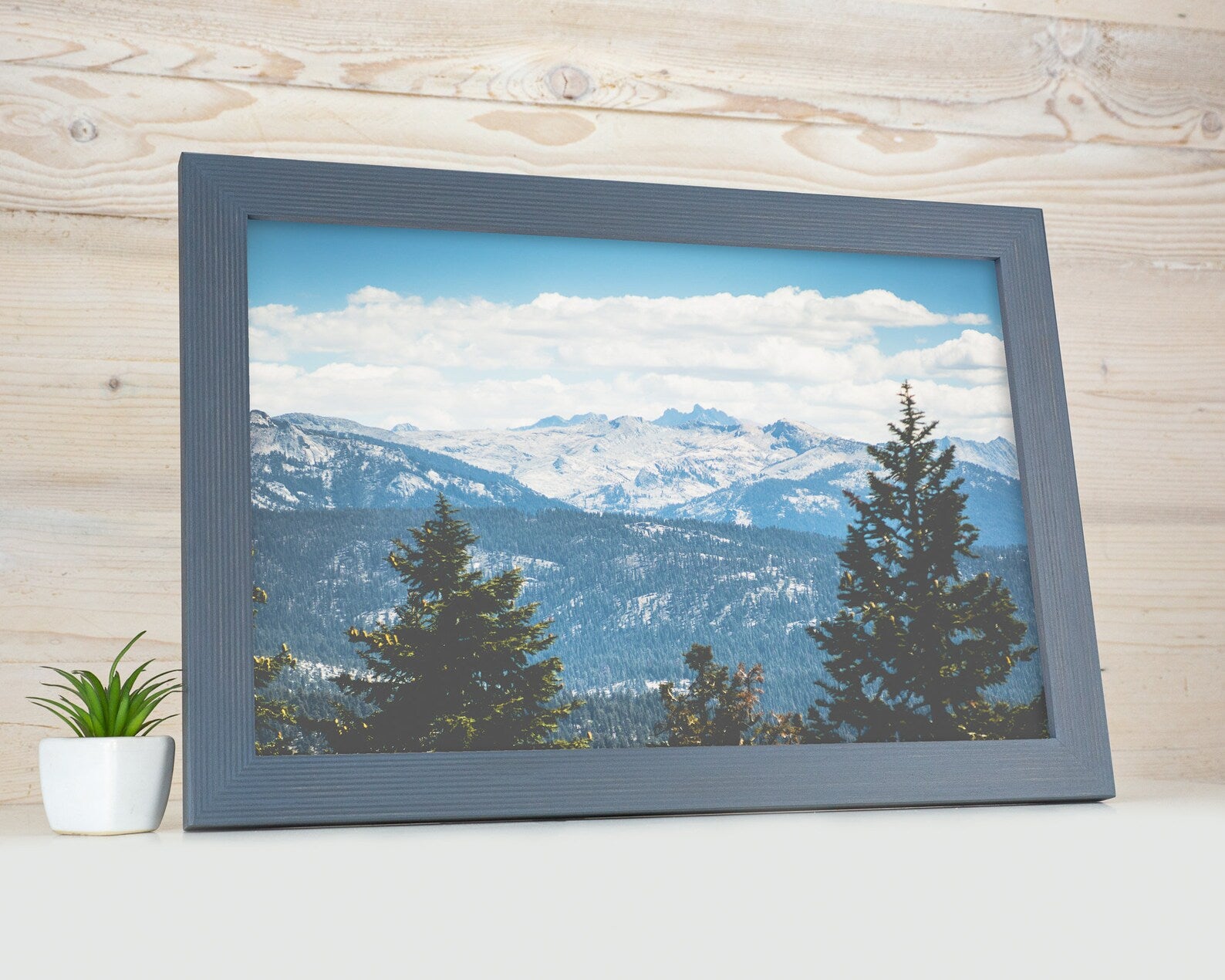 Framed print of a mountain landscape with trees on a wooden surface. Grey Wooden Picture Frame, Handmade Custom Size Photo Frame, Stripy Design Poster Frame A1 A2 5x7 10x10 8x10 12x18 16x20 18x24 20x30 24x36