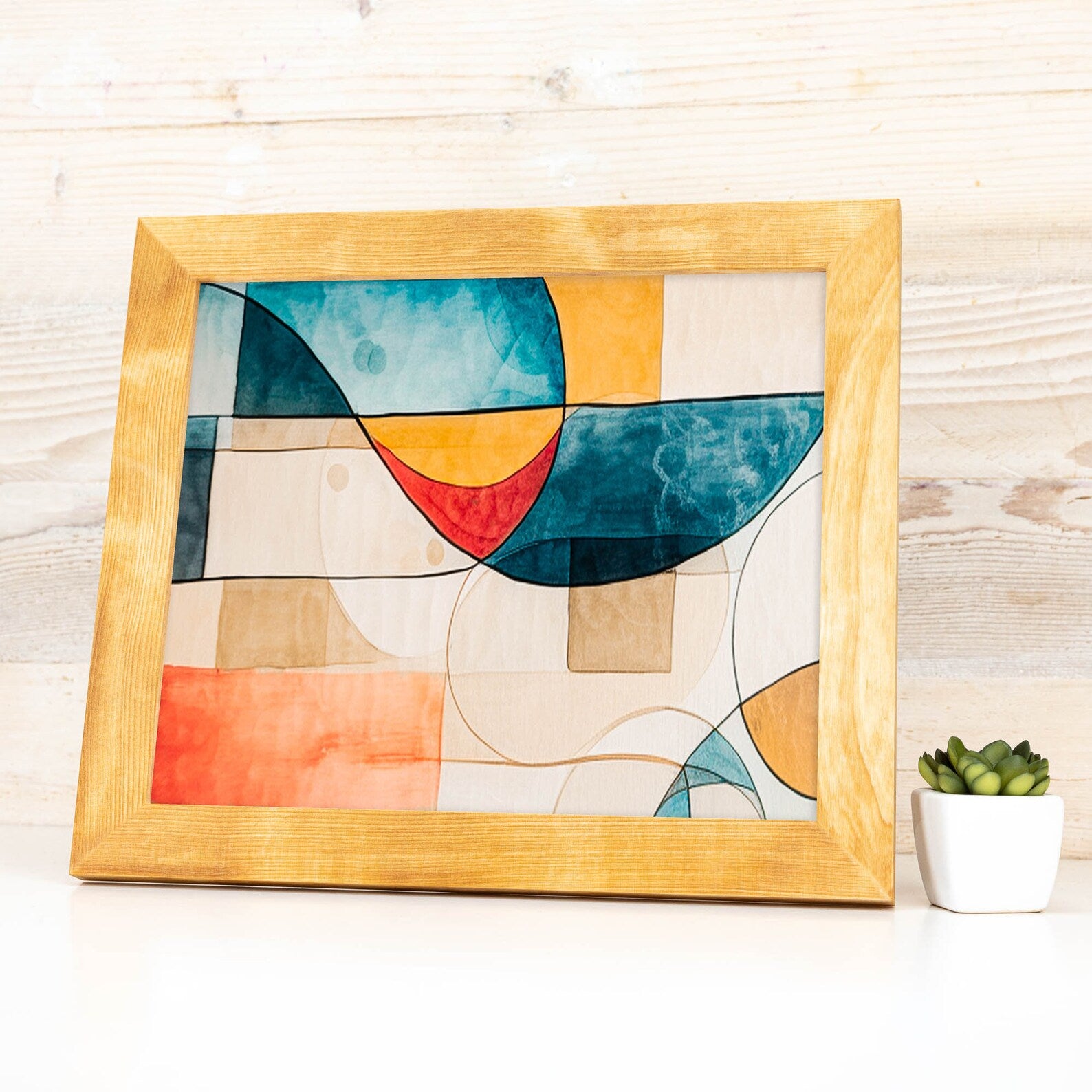 Abstract art piece in a wooden frame on a light wooden surface with a small plant. Natural BIRCH Picture Frame in Flat Style, Handmade Solid Hardwood Photo Frame, Modern Gallery Wall Frames, Custom Size A1 5x7 11x17 24x36