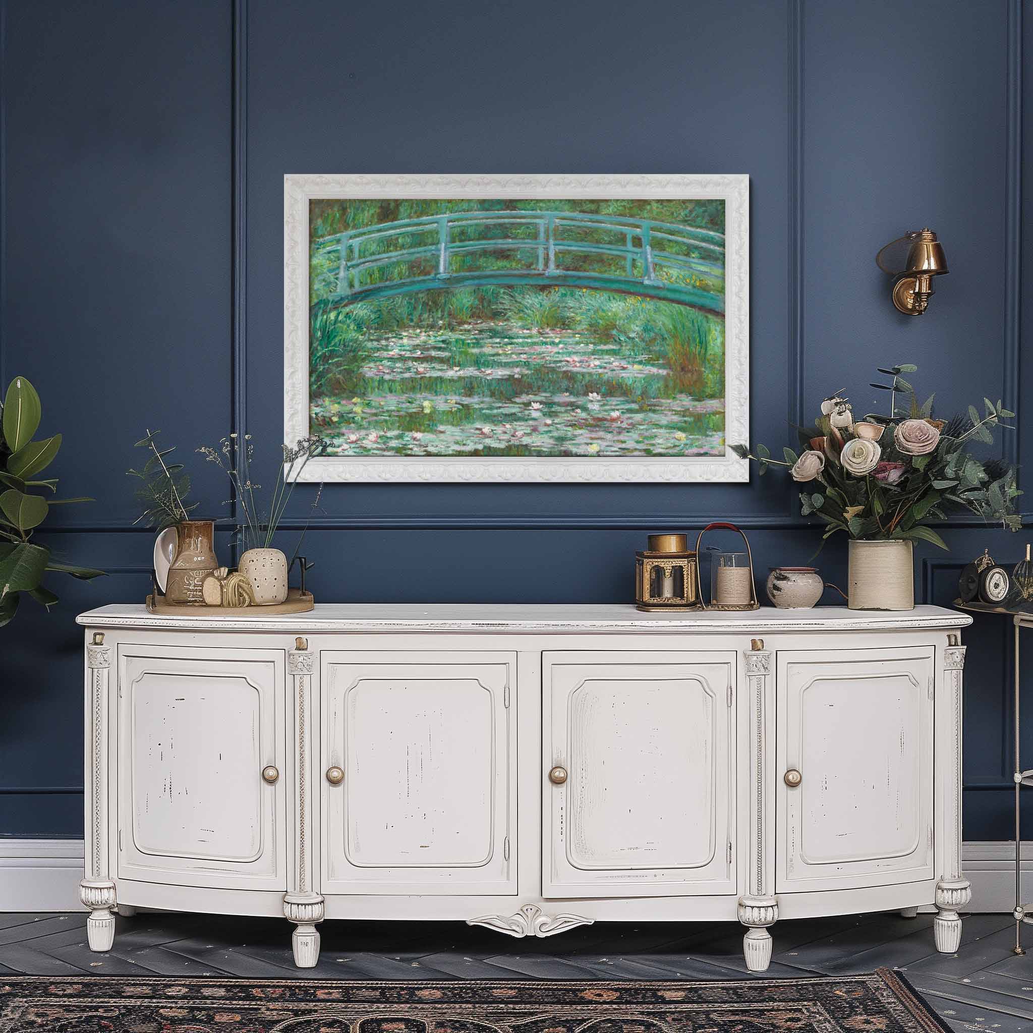 White wooden cabinet against a blue wall with a white samsung frame tv 32 inch big with sophisticated garden art