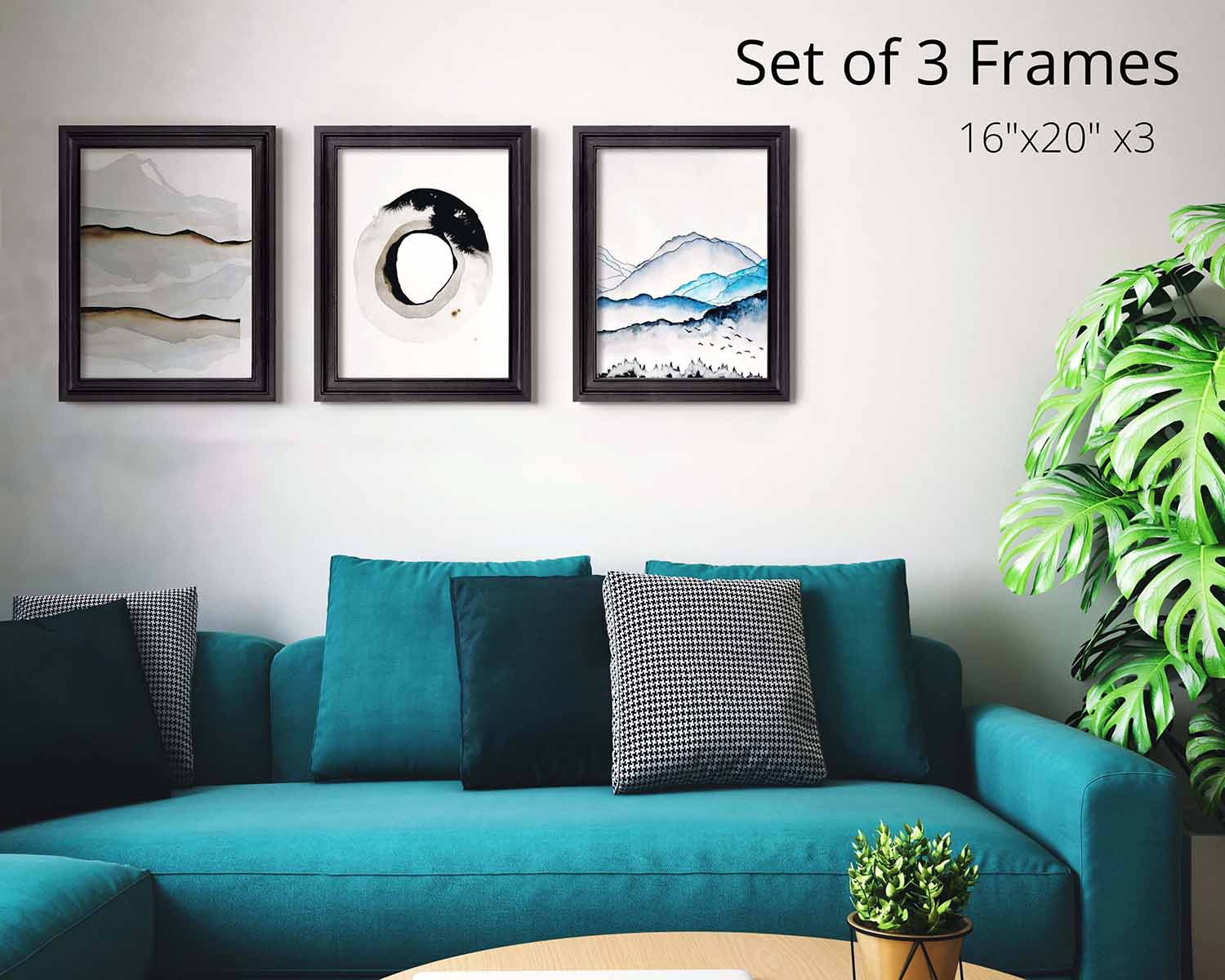 Set of 3 wooden quality handcrafted picture frames in custom color and size set on a blank wall above a blue couch with multiple decor pillows on top.
