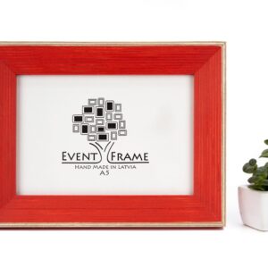 A classic light red picture frame with a white border and a black logo in the center, displayed next to a small potted plant. Red Wood Picture Frame, Hand Painted Artwork frames, Rustic Home Decor, Square 5x5 Photo Frame, Any Size A5 A4 4x6, 5x7, 8.5x11, 8x10, 8x12