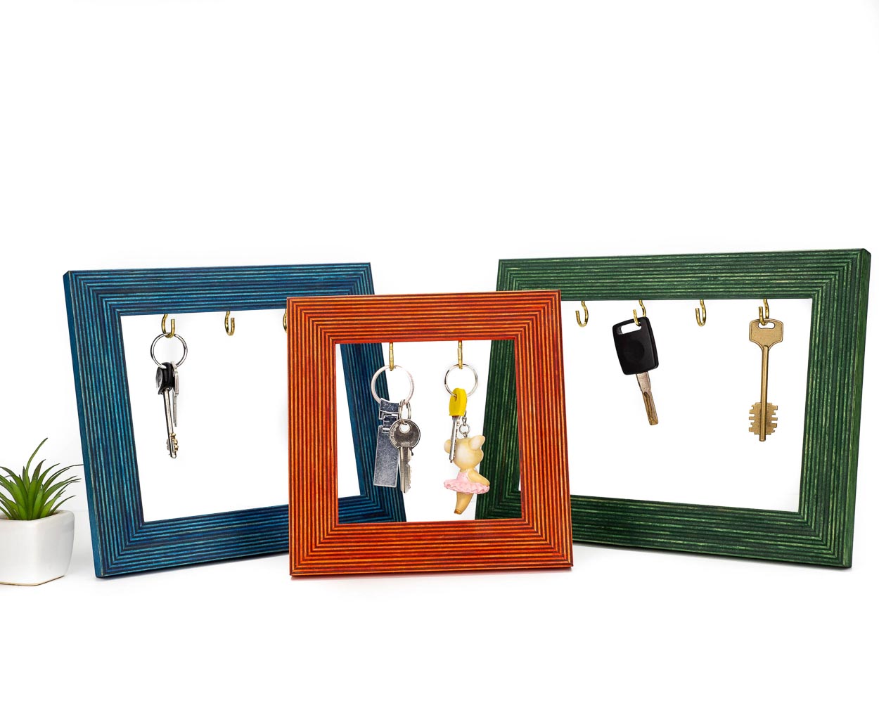 Striped wooden quality frames with hooks to hold keys jewelry and accessories in different colors.