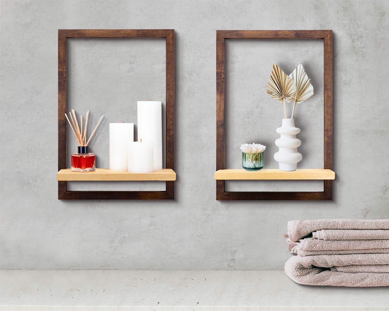 Two dark brown framed shelves on the bathroom wall used as home decor.