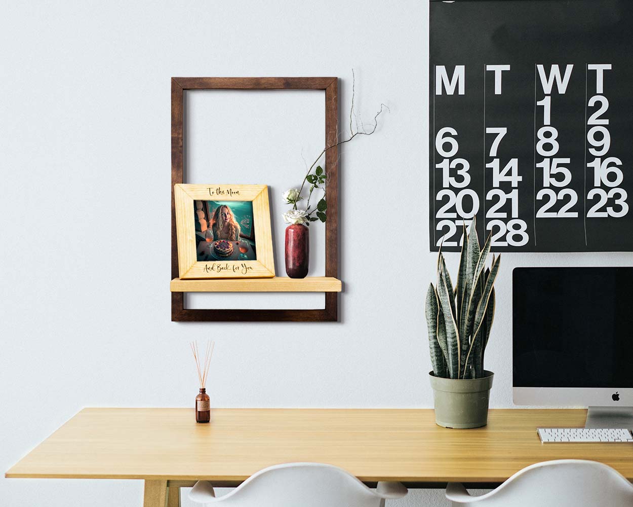 Framed floating shelf in solid dark brown wood, modern wood plant shelf, holding home decor for office above desk.