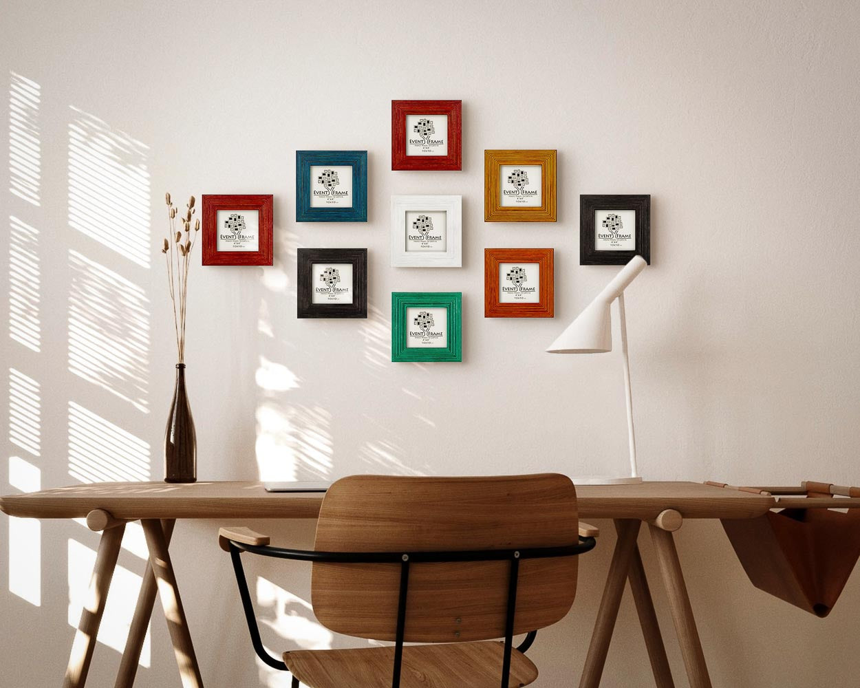 Colorful handmade wooden picture frame set for square photos above a desk in natural home office environment.
